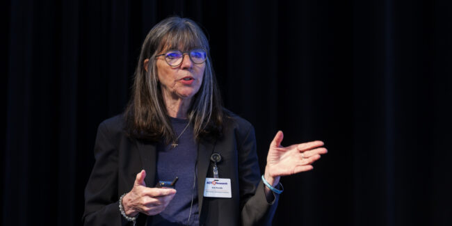 Industry expert Ann Rundle delivers insights and analysis during a presentation session at an ACT Research transportation industry seminar.