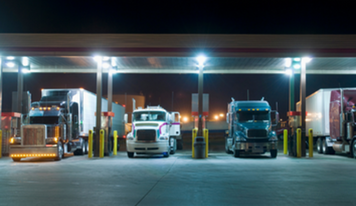 Trucks at Gas Station at Night Stock Photo