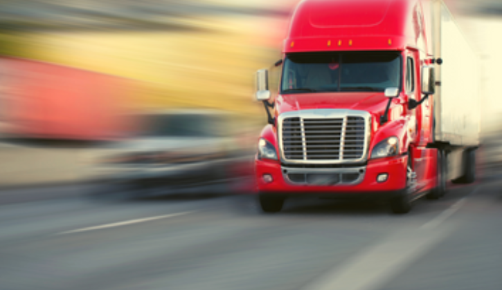 Red semi truck with blurry background